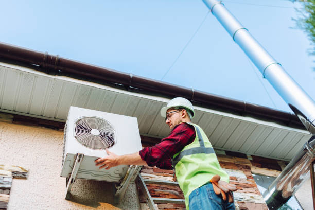 istock Technician in uniform repairing heat pump 1534531376