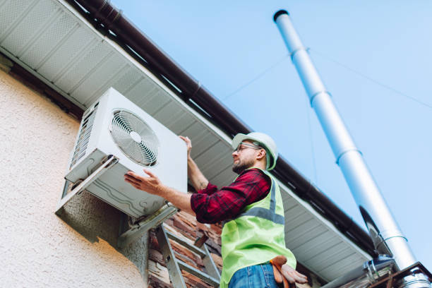 istock Technician in uniform repairing heat pump 1534540200