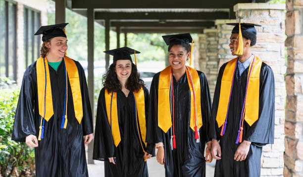 istock Four multiracial high school graduates side by side 1534542901