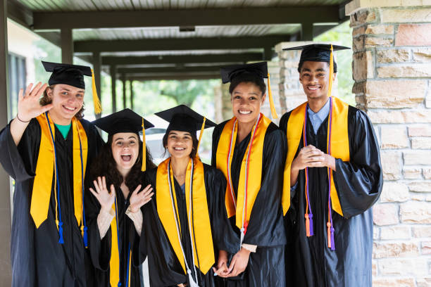 istock Five multiracial high school graduates smiling at camera 1534543124