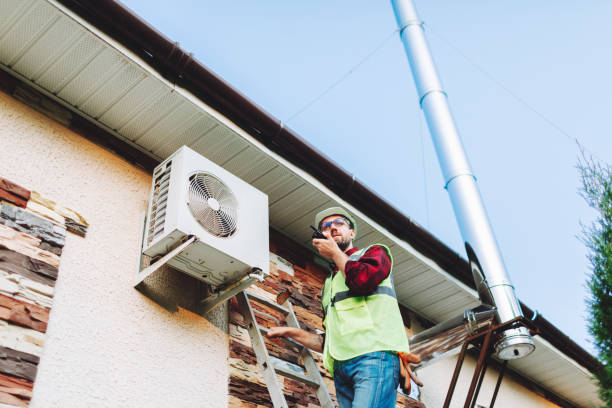 istock Technician in uniform repairing heat pump 1534547363