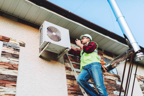 istock Technician in uniform repairing heat pump 1534555939