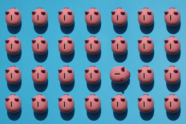 istock Piggy bank on yellow background 1534557494