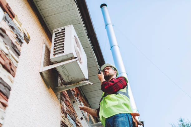 istock Technician in uniform repairing heat pump 1534562079