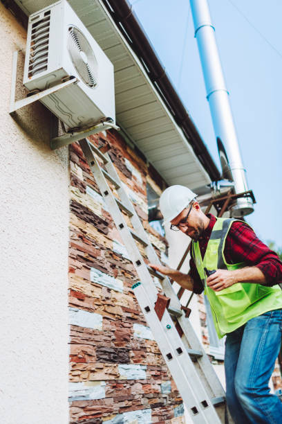 istock Technician in uniform repairing heat pump 1534596876