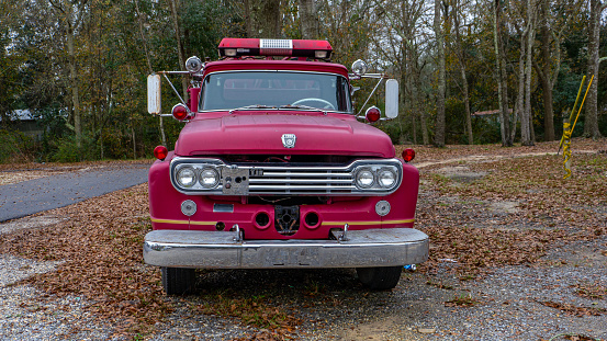 Vintage old Fire Truck parked outside of fire station outside of New Orleans Louisiana