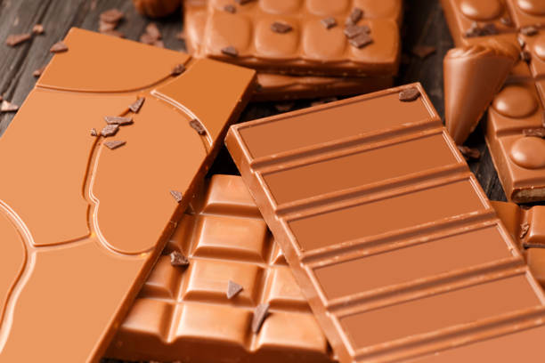 istock Many different chocolate bars on a dark wooden background. 1534643401