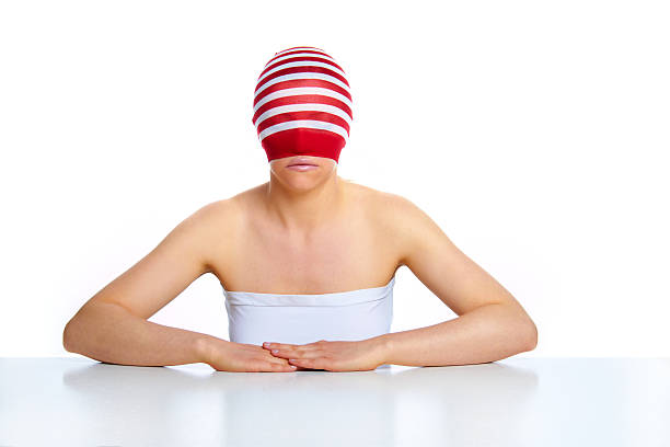 young happy woman with a stocking on her head stock photo