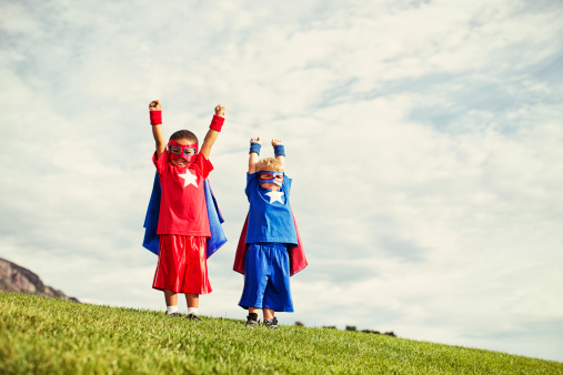 Two superheroes are ready to save the world. It is never too early to be super.