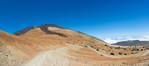Serpentine road on the way to the top of Teide Mount. Footpath to Altavista Refuge, Tenerife Island, Canary.