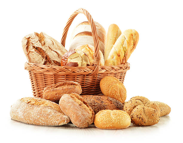 istock Bread and rolls in wicker basket isolated on white 153471914