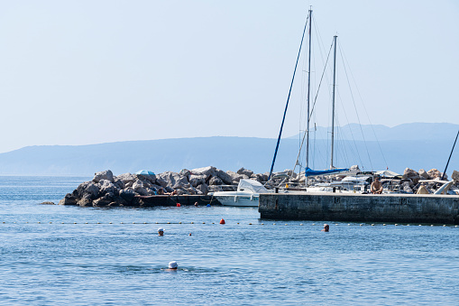 Opatija, Croatia. July 10, 2023. entrance of the small marina in the sea in front of the city