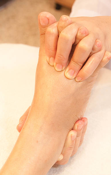 istock reflexology foot massage, spa treatment,Thailand 153474084