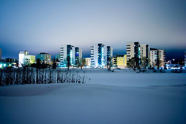 A photo from a very snow heavy winter that hit the city of Pori, Finland. Night show with city lighting the clouds above