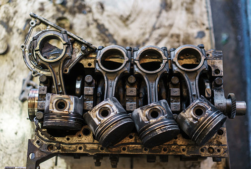 Close up view of a car engine in repair shop