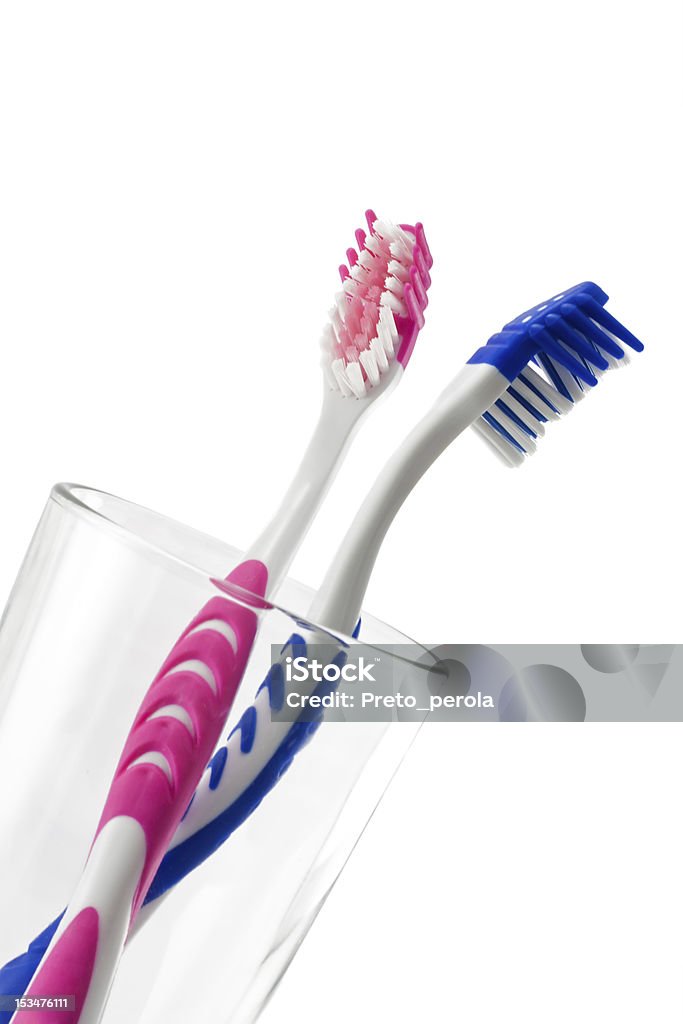 two toothbrushes in glass Bathroom Stock Photo