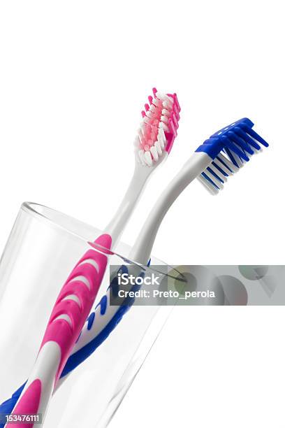 Two Toothbrushes In Glass Stock Photo - Download Image Now - Bathroom, Beauty, Blue