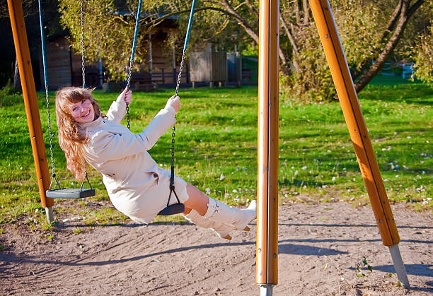 istock Swinging Woman 153476722