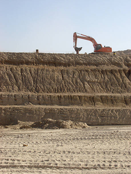 Brick clay quarry and excavator stock photo