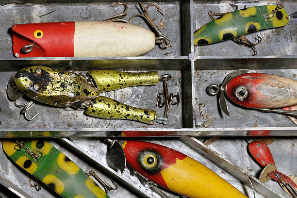 Colorful fishing lures with hooks are laid out on a table,tools for anglers in freshwater and saltwater fishing