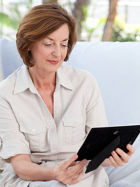 istock Woman looking at her photo 153478734