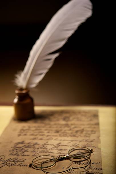 istock Glasses and inkwell on an old letter 153479298