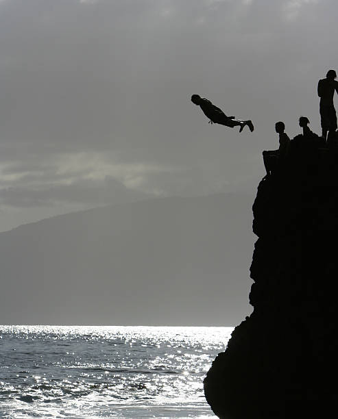 istock Suspended above the ocean, cliff diving in hawaii 153479481