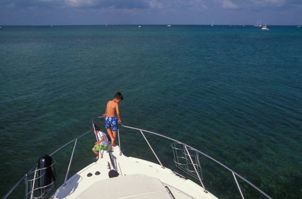 istock Two boys enjoying on the bow of a boat 1534795521