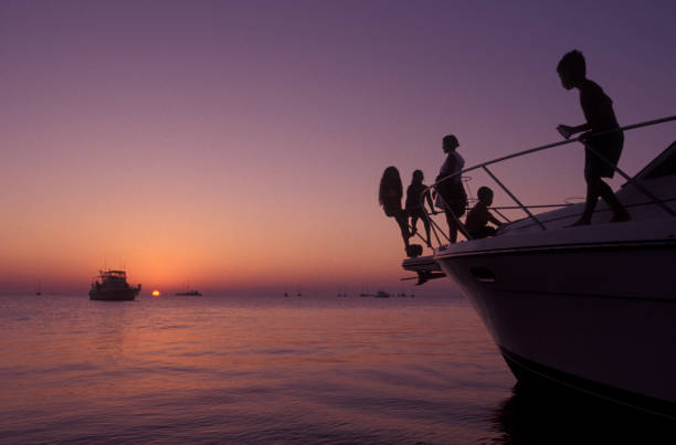 Group of people watching the sunset from a boat, Florida Keys, USA