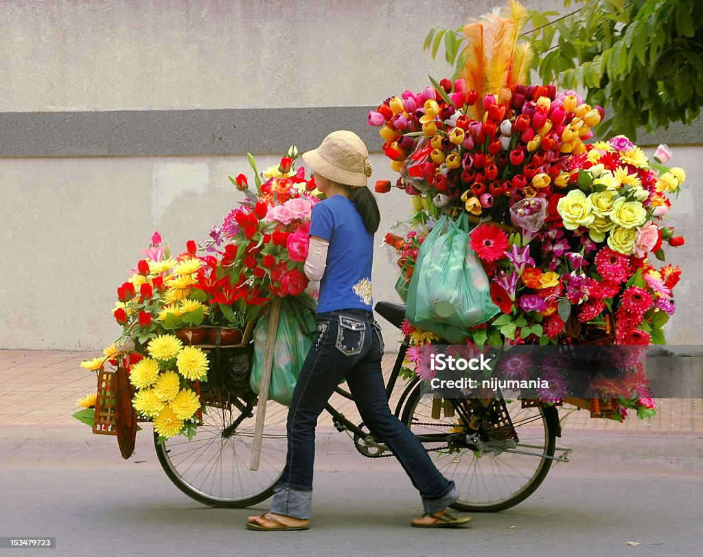 Florist A mobile florist in Vietnam. Quite unlike the typical imagination of a florist in the western world. Bicycle Stock Photo