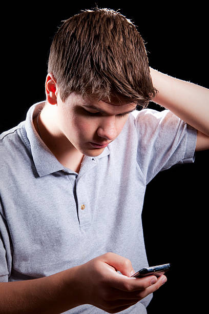 istock Young man looking at smartphone 153479855