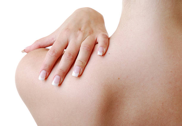 istock Woman's manicured hand on shoulder 153479879