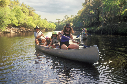 Family of four kayaking in the river, Peace River, Florida, USA