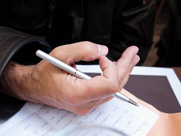 istock Writing man's hand with a pen and paper 153481834