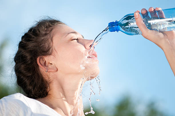 istock Beautiful woman drinking water. Thirst 153481998