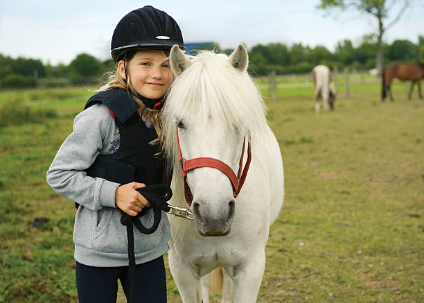 istock Girl with pony 153483460