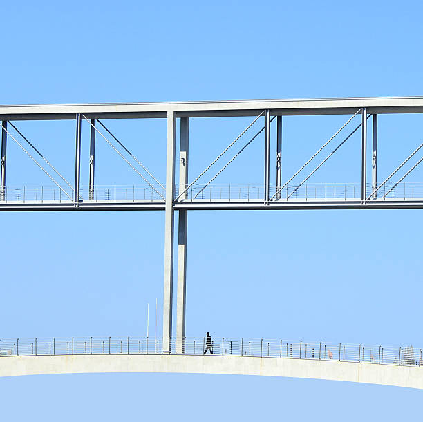 istock business man walking in modern architecture 153483737