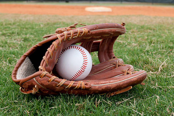 istock Baseball in Old Glove on Field 153483740