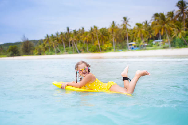 istock Kids playing on beach. Children play at sea. 1534849497