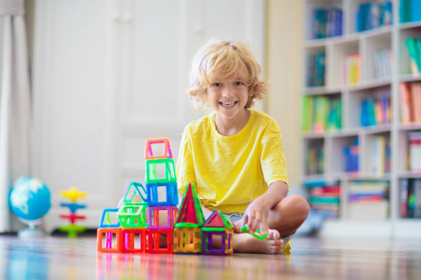 istock Child playing with magnetic building blocks. 1534860831