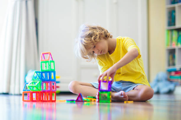 istock Child playing with magnetic building blocks. 1534861452