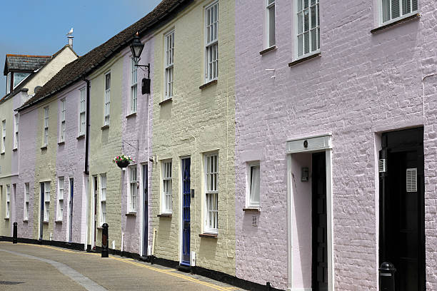 Street in Highcliffe Yellow and Pink houses in Highcliff, Dorset christchurch england photos stock pictures, royalty-free photos & images