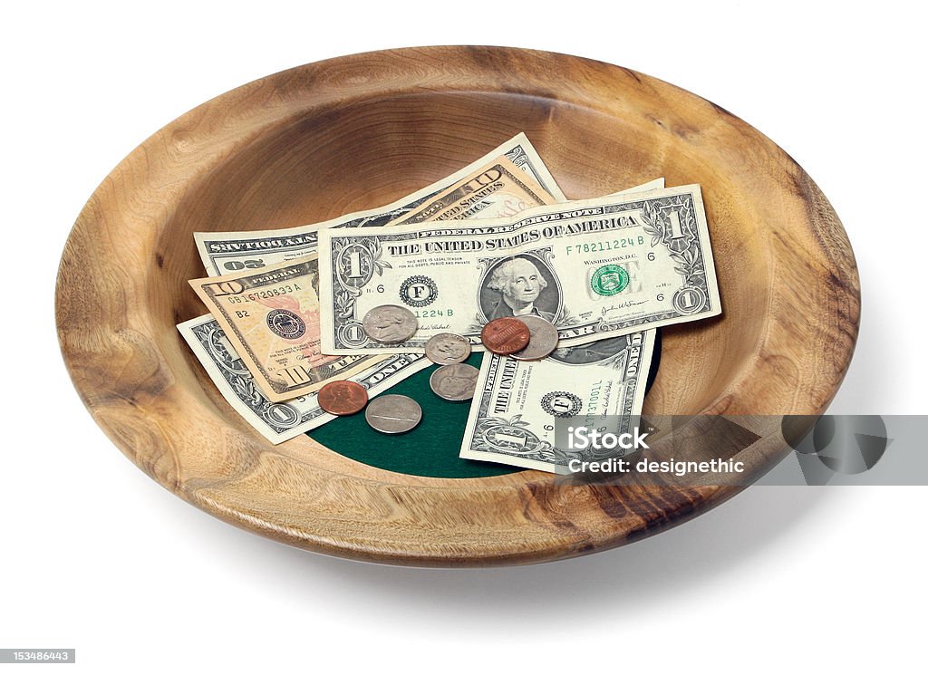 Wooden Offering Plate Wooden offering bowl with paper bills and coins Plate Stock Photo
