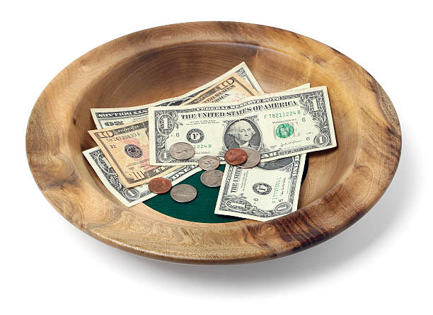 Wooden Offering Plate Wooden offering bowl with paper bills and coins religious offering stock pictures, royalty-free photos & images