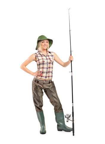 Full length portrait of a blond fisher woman posing isolated on white background