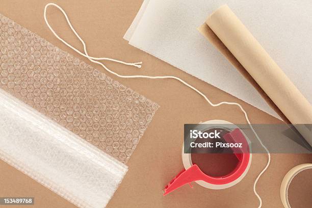 Packaging Materials With String Stock Photo - Download Image Now - Bubble Wrap, Packing, Adhesive Tape
