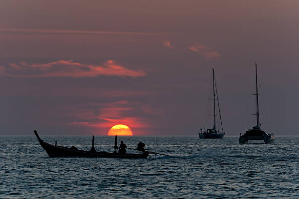 istock sunset and sailboats 153490428