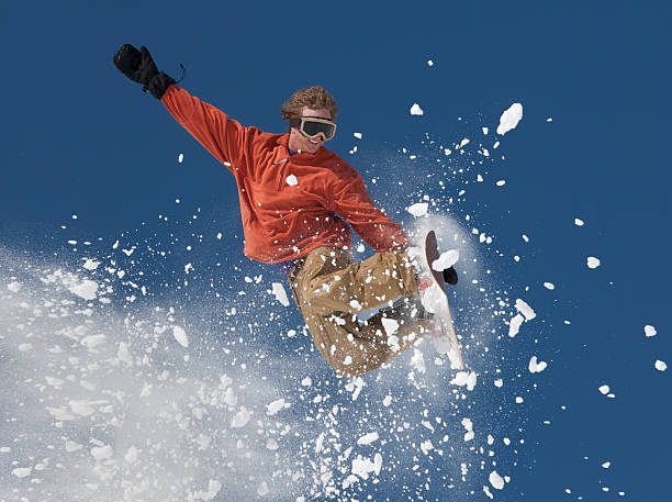 istock Snowboarder in Mid-Air Jump 153490898