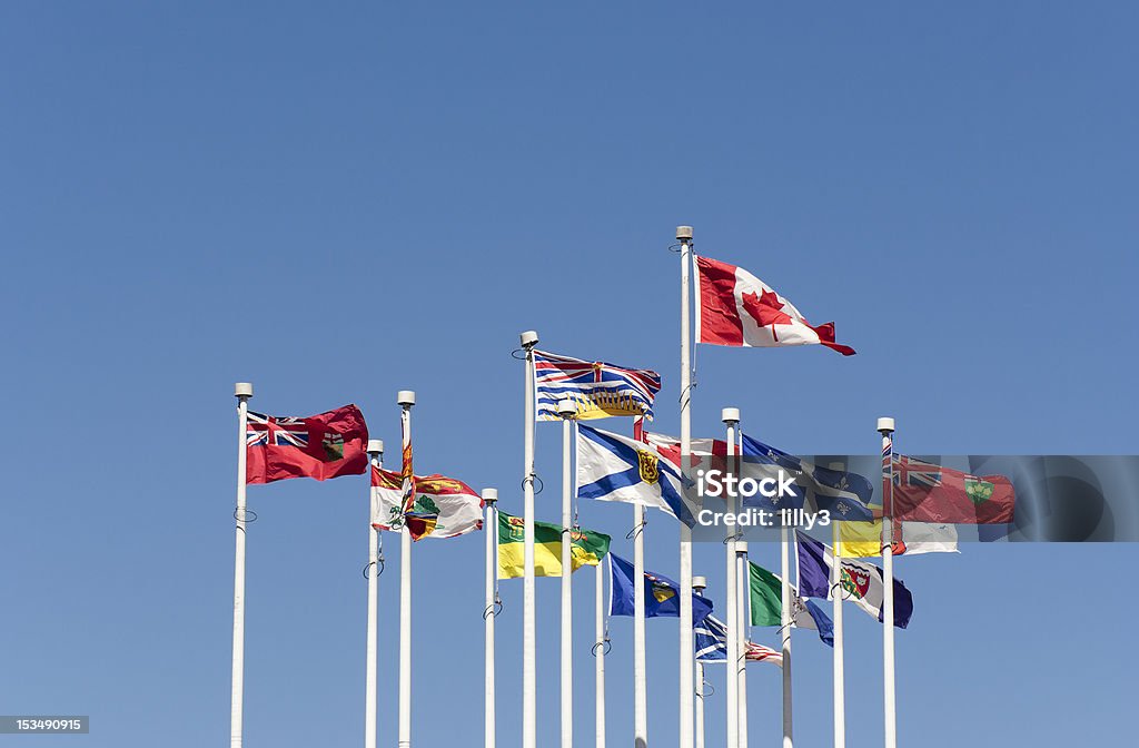 Flags flying in the Wind Flags flying in the Wind - Flags of the Canadian Provinces on Canada Place, Vancouver, British Columbia, Canada Canada Stock Photo