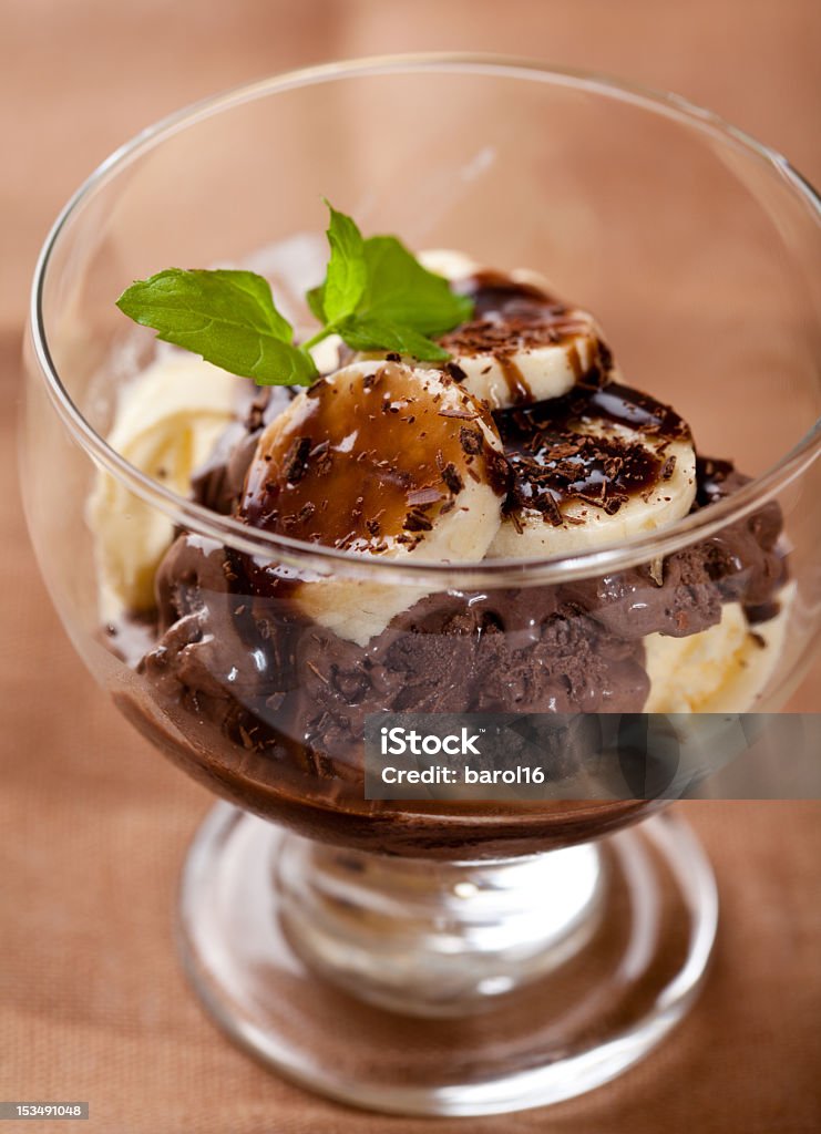 Chocolate and vanilla ice cream with banana close up of chocolate and vanilla ice cream with banana and chocolate sauce Banana Stock Photo